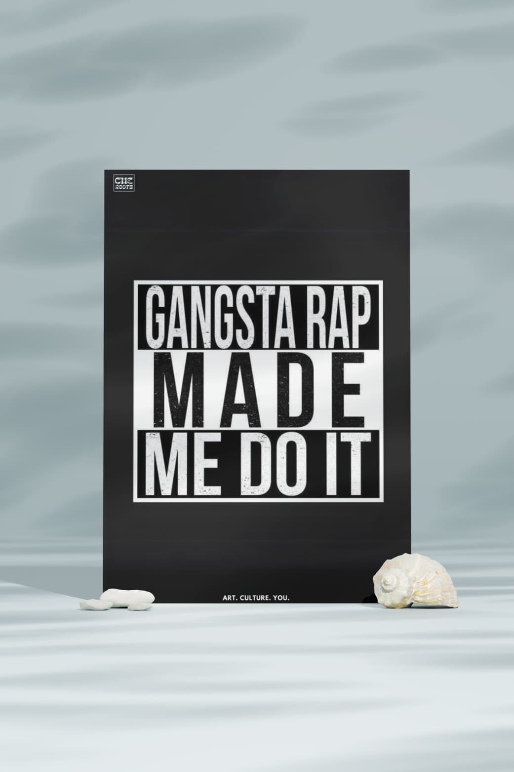 A black poster with the text "GANGSTA RAP MADE ME DO IT" in bold, white letters. The words "ART. CULTURE. YOU" are included at the bottom.